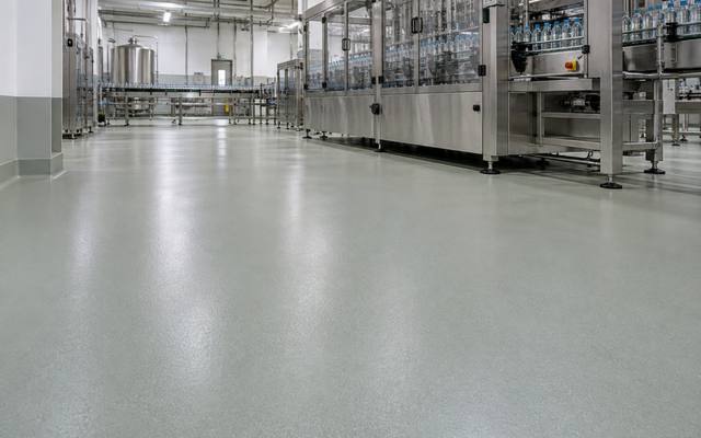 Pale green floor under a bottling line in Moncton