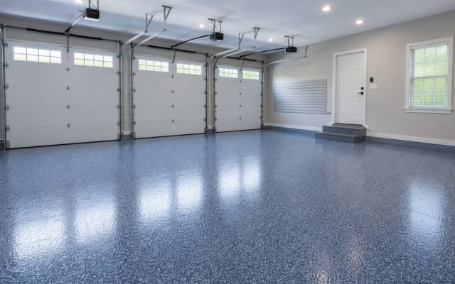 Blue flake epoxy floor in a three-car garage in Southeast New Brunswick