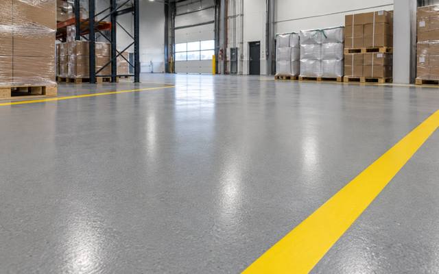 Yellow line across a pallet staging floor in Moncton, New Brunswick